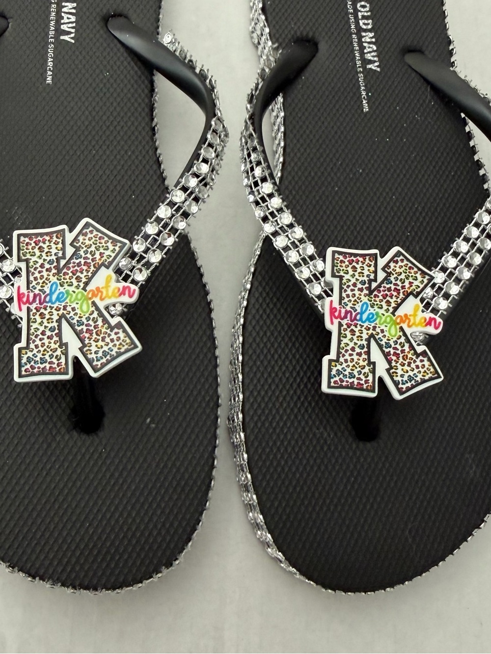 Old Navy Black Rhinestone Flip Flops with Colorful 'K' Kindergarten Charm